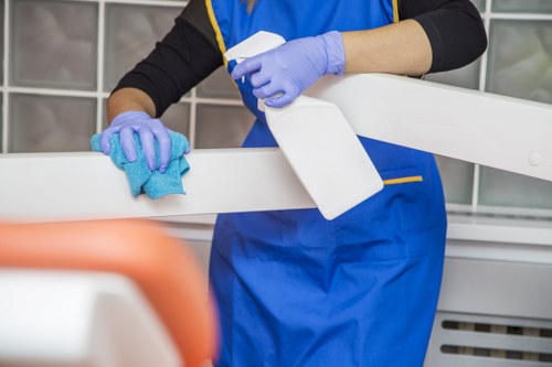 Technician cleaning an oven door and interior in a Richmond home
